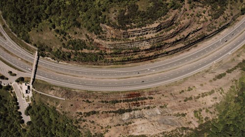 An Aerial Footage of a Landscape and a Highway