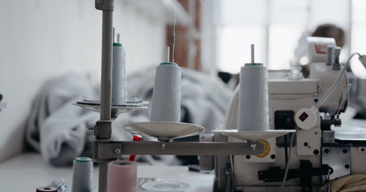 Sewing machine at work in the Okara Impex facility