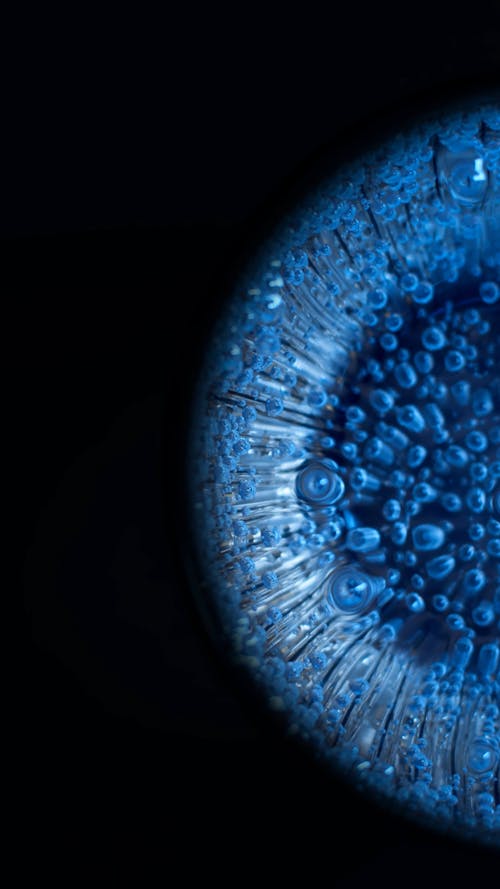 Close up of Fizzy Liquid in Blue Light