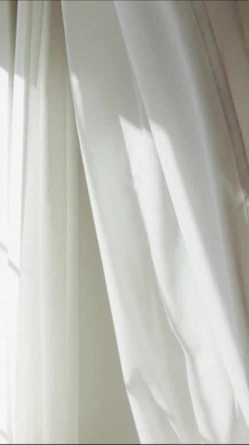 A White Curtain in the Sunlight