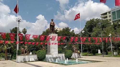 A Monument In The Park With Flags Of Turkey