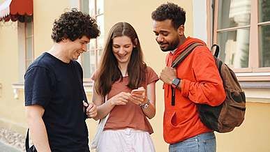 video of people looking on smartphone