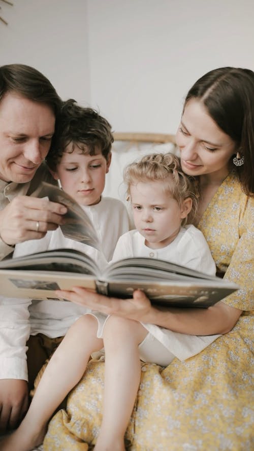 A Family Reading A Book