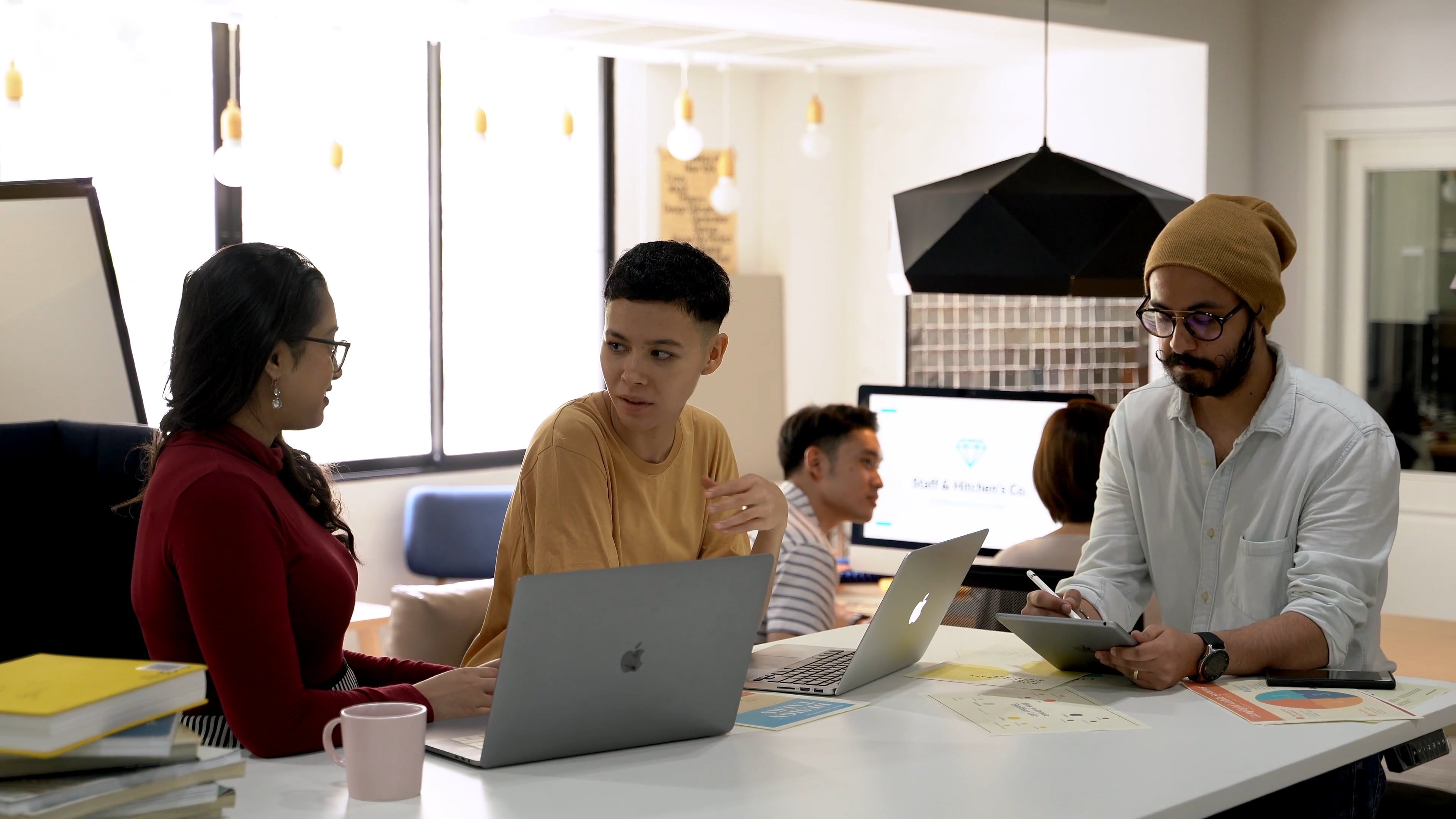 A Group Of People Working Together Inside An Office · Free Stock Video