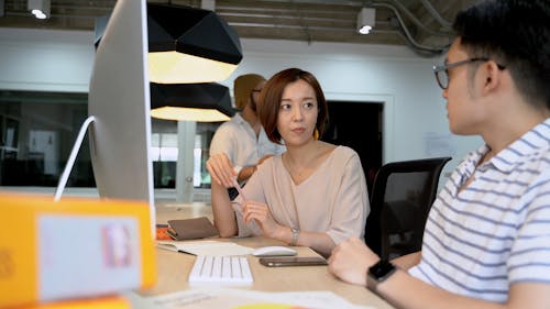 Man And Woman Discussing At Work