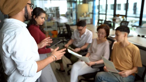 Man Discussing Work At A Meeting