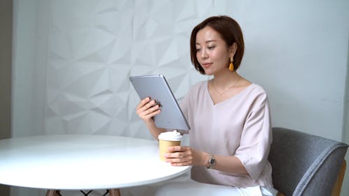 Video Of Woman Looking On Tablet