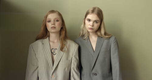 Two Female model Wearing Suits