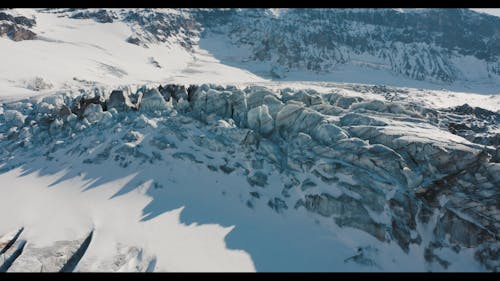 A Drone Footage of a Snow Covered Mountain