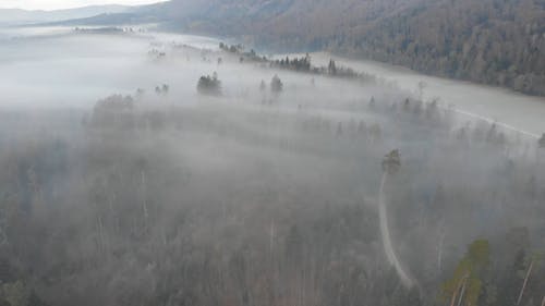 Aerial Footage Of A Foggy Landscape