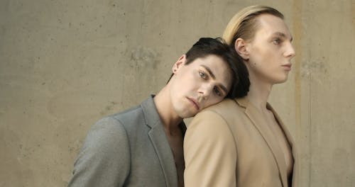 Two Male Models Standing Close To Each Other