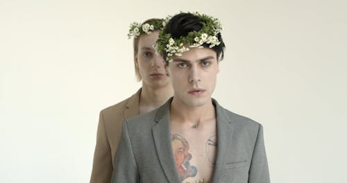 Two Male Models Wearing A Floral Headdress