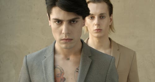 Two Male Models With Serious Facial Expressions