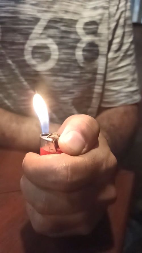 cigarette lighter video Using in dark by Arthur Cauty - Stock Cigarette Lighter Videos, Download The