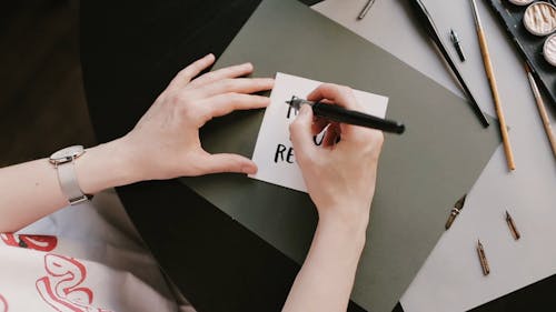 Person Using Fountain Pen