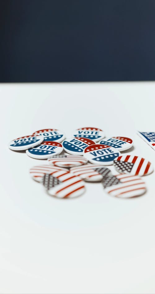Pins With the Word Vote and the American Flag