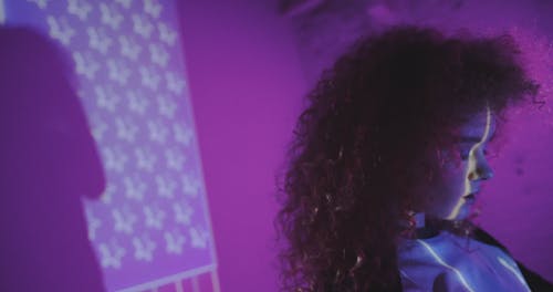 Woman in Front of a Projection of the American Flag