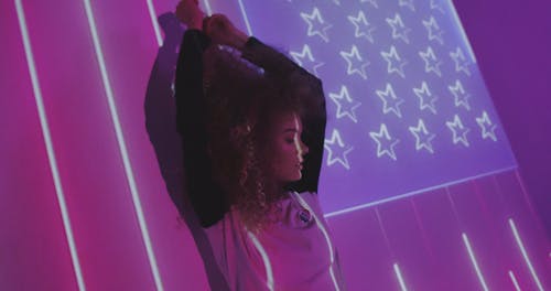 Woman in Front of a Projection of the American Flag