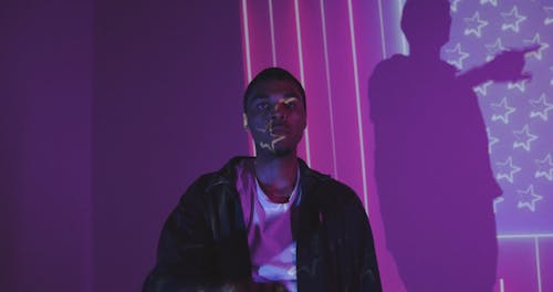 Man in Front of a Projection of the American Flag