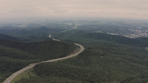 Drone Footage Of Green Woods On Hills And Mountains