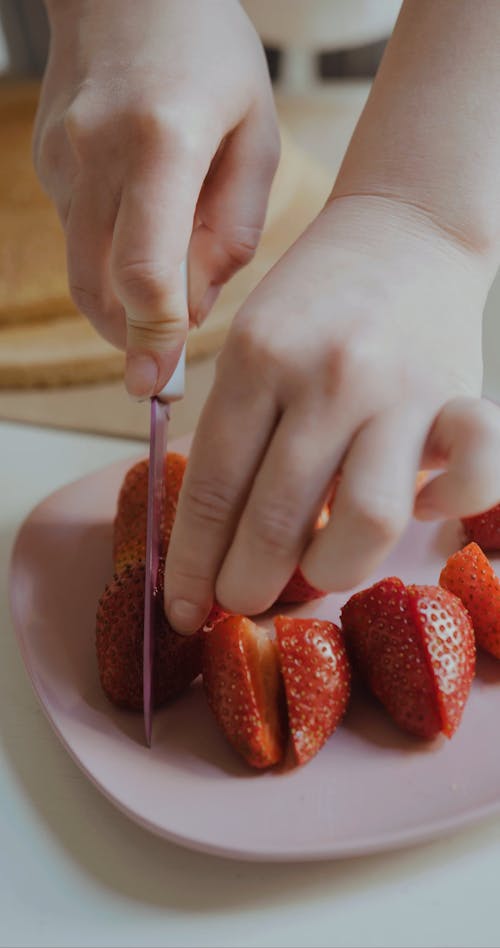 Cutting Strawberries In Half