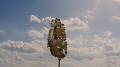 A Golden Sculpture of a Sailing Ship