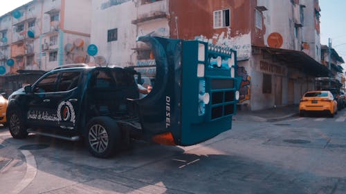 Video Of A Customized Pick-up Truck Parked Outside An Old Building