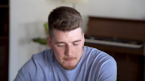 Shallow Focus of Man in Blue Shirt Smiling