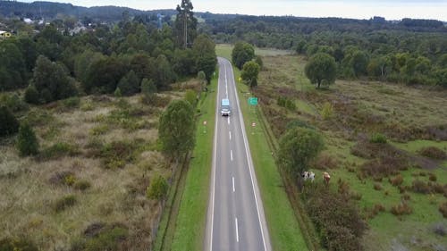 Drone Footage of a Bus Traveling on Road