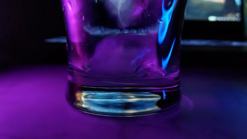 Pouring Drink in a Glass with Ice