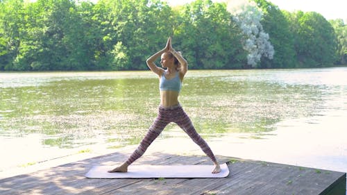 Video Of Woman Doing Yoga Beside River