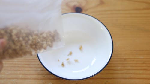 Video Of Person Putting Greek Yoghurt On Cereals