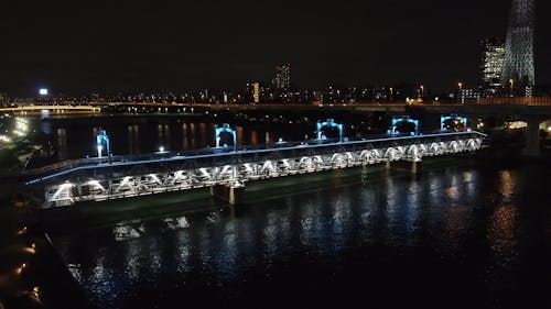 Drone Footage of a Railways and a City at Night