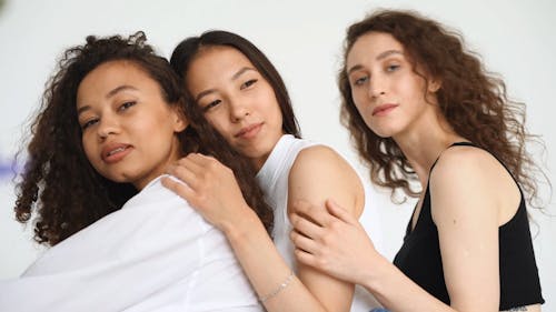 Three Women Holding Each Other 