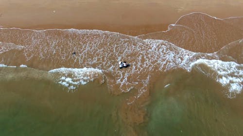 An Aerial Footage of a Couple on the Beach