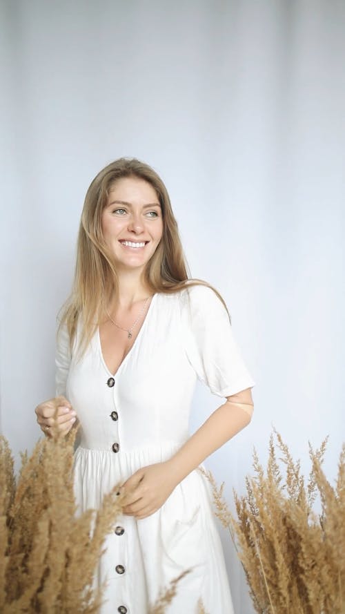 Video Of Woman Standing Beside Plants