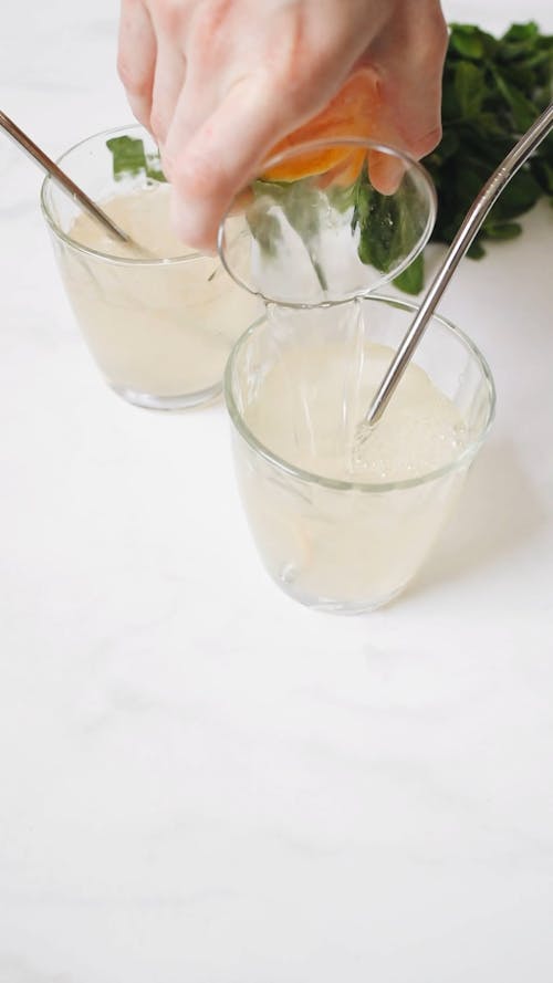 Close-Up Video Of Person Pouring Beverage On Glass