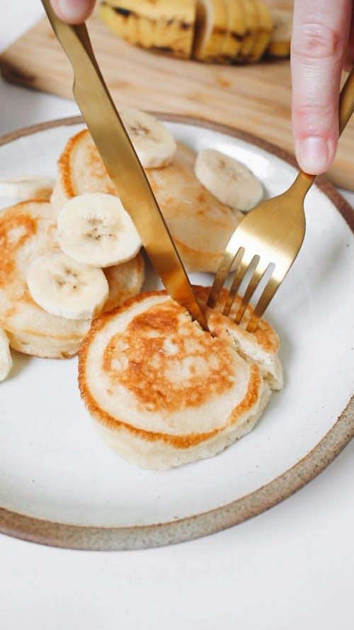 Close-Up Video Of Pancake With Sliced Banana On Top