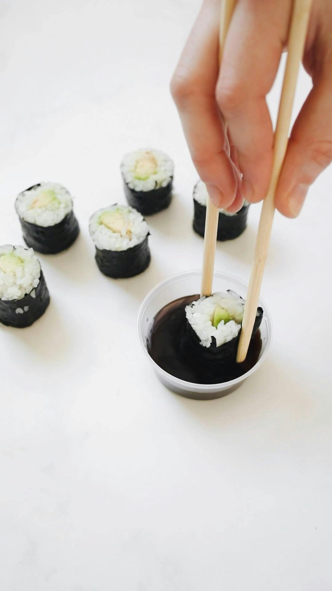Video Of Person Dipping Sushi Rolls On Sauce Free Stock Video Footage