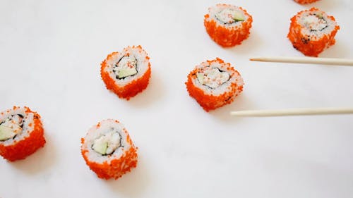 Close-Up Video Of Person Picking Up Sushi Rolls