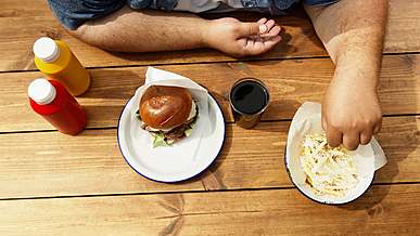 person easting a food at the table