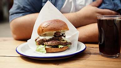 person sitting on a table with food