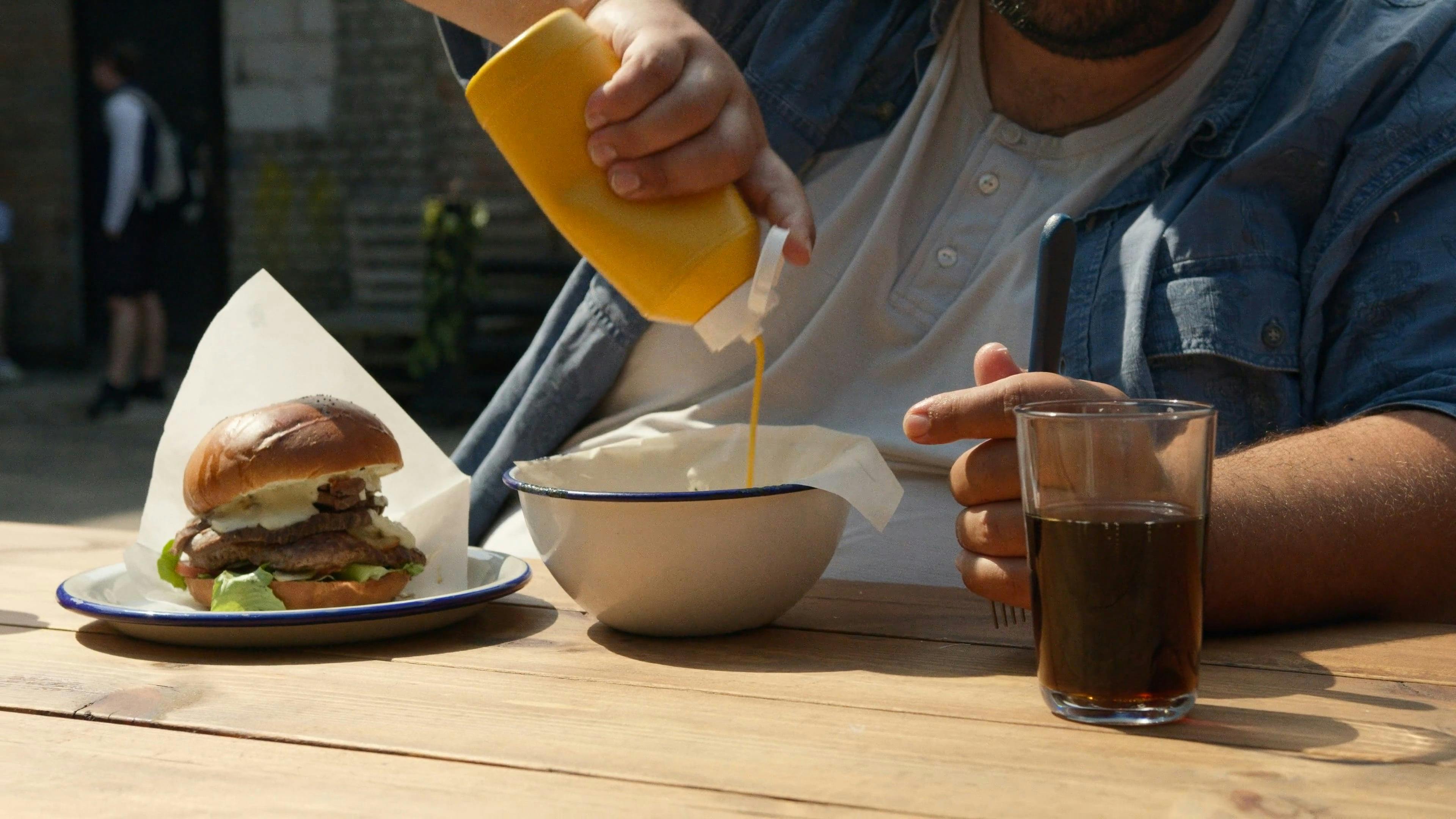 Man Putting Mustard On His Food · Free Stock Video