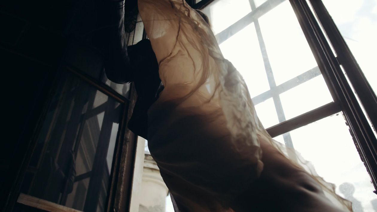 A woman is standing in front of a window Free Stock Video Footage ...