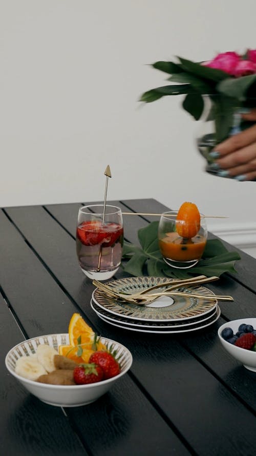 Person Preparing Food at the Table