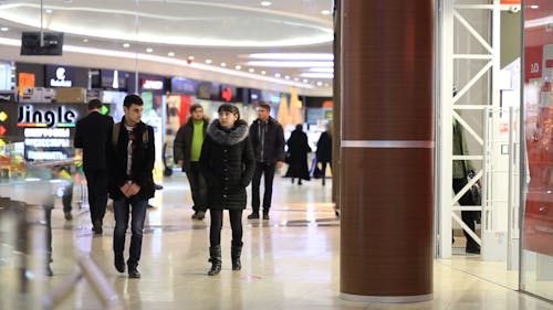 Walking up to inside mall entrance to No, Stock Video