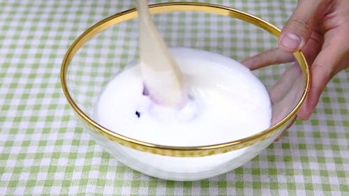 Person Whipping Blueberry And Cream Milk