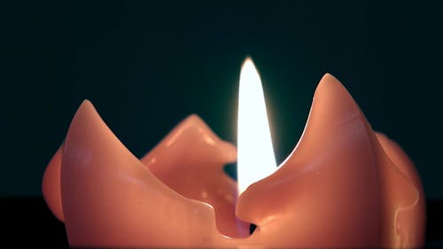 A Lighted Candle In Close-up View