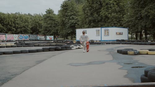 Young Man Doing a Skateboard Trick at the Playground