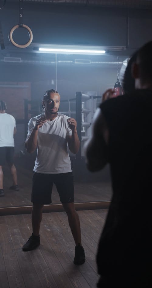 Two Men Using A Medicine Ball In An Exercise Routine